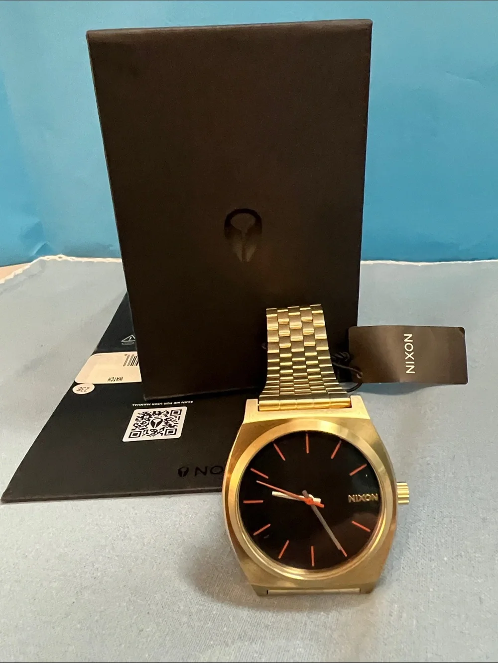 Nixon Gold Watch with Black Dial and Red Accents, Time Teller Model